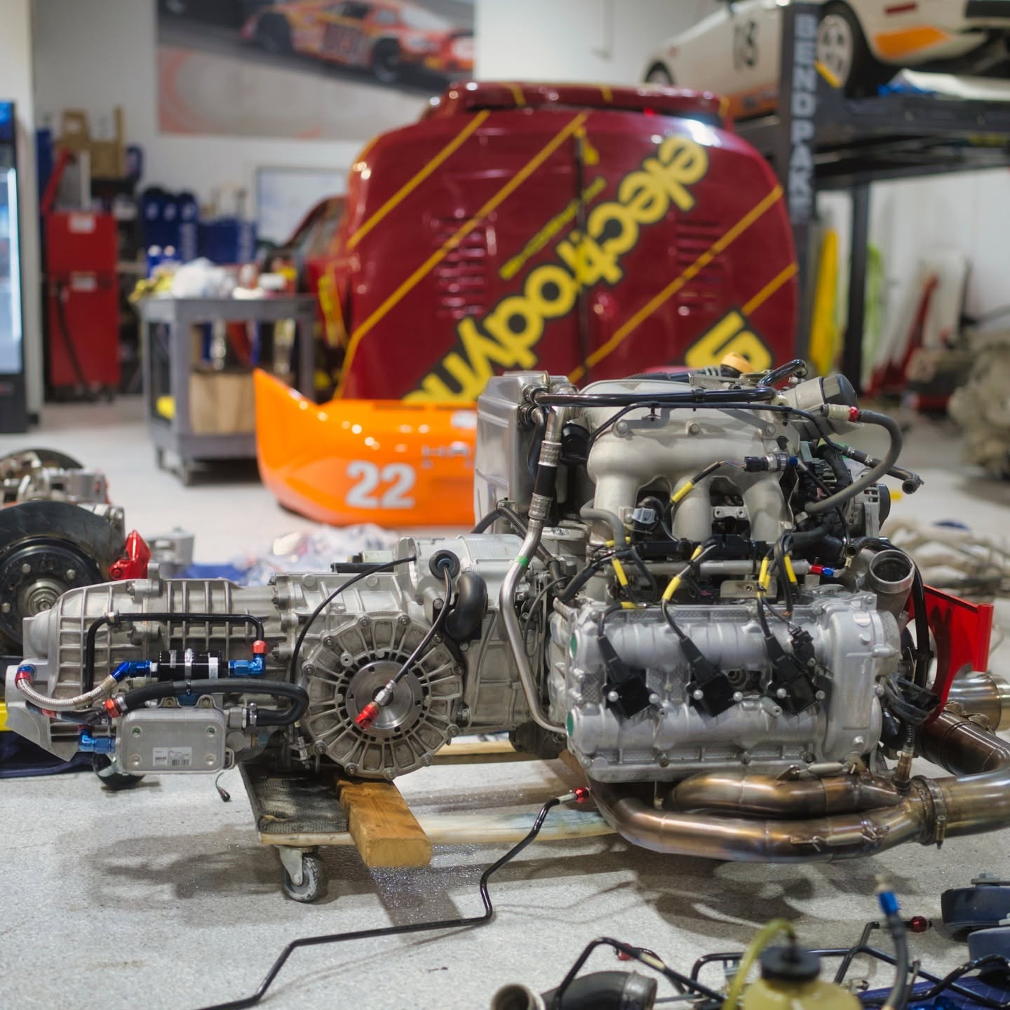 Porsche flat-six engine and transaxle assembly on the shop floor at DAS Sport