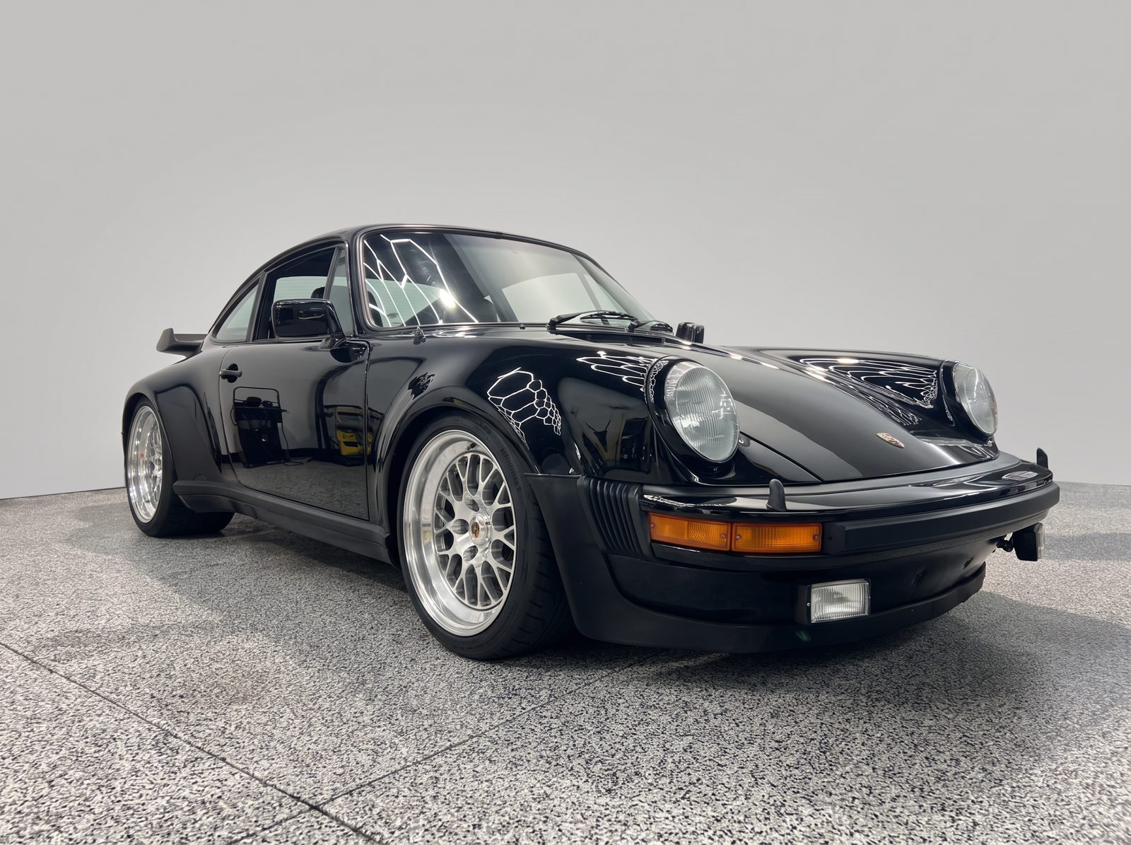 Black Porsche 911 Turbo build on polished BBS wheels